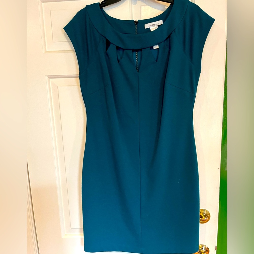 Very cute dress for spring. Lovely neckline and fits curves nicely